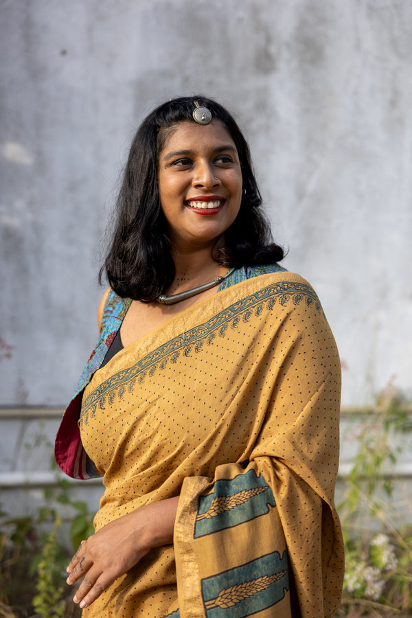 'CHAITANYA: Ochre' Ajrakh Maheshwari Handloom Saree