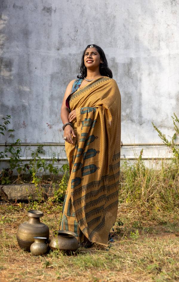 'CHAITANYA: Ochre' Ajrakh Maheshwari Handloom Saree