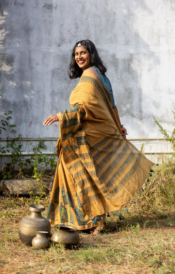 'CHAITANYA: Ochre' Ajrakh Maheshwari Handloom Saree